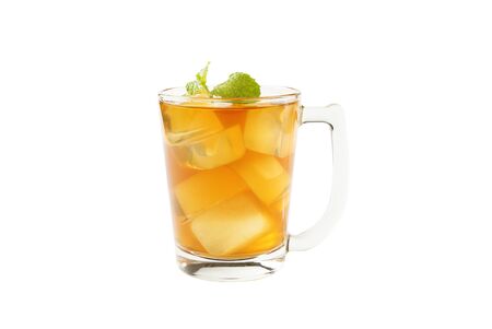 A cup of tea with a tea that has a good flavor, with ice and mint leaves on a white background.の写真素材
