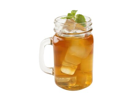 A cup of tea with a tea that has a good flavor, with ice and mint leaves on a white background.の写真素材