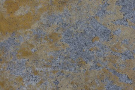 Old yellow concrete floor, cracked, cracked background imageの写真素材