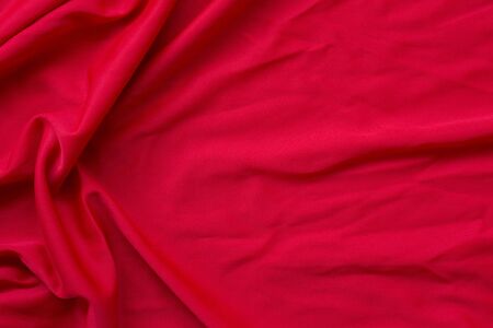 Beautiful red fabric is suitable for making backgrounds in various concept designs in the top view.の写真素材