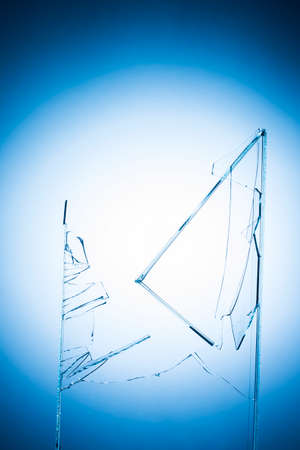 Colorful abstract image blurred blue background with light in the center with gradient broken glass in the center of the image.の写真素材