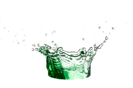 Green water or juice scattered on a white background. Freshness concept.の写真素材