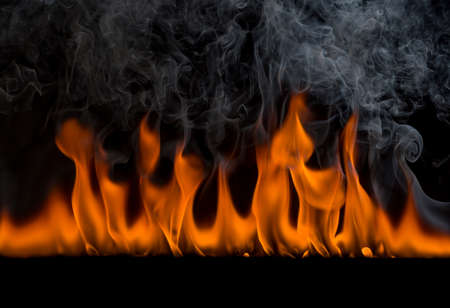 burning flame with smoke and burning heat On a black backgroundの写真素材