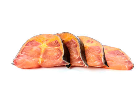 Fresh fish fish steak cut into separate pieces on white backgroundの写真素材