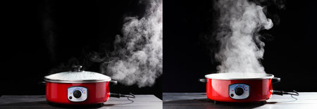 Set-An electric pot or pan for boiling water or boiling soups. smoke on black background for people cooking and boiling water in the kitchenの写真素材
