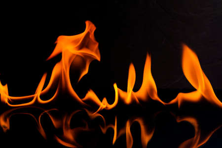the burning flame from gas oil png high heat isolated on black backgroundの写真素材