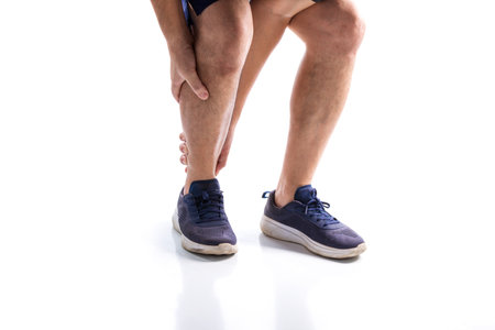 Elderly men or women or young people have knee, ankle, joint pain, arthritis, and tendon problems. exercise-induced muscle pain from gout and uric acid isolated on white backgroundの写真素材