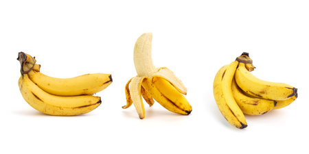 Yellow ripe banana fruit, ripe banana with black dots on the peel. Banana overripe rotten, isolated on white backgroundの写真素材