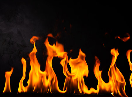 fuel flame png heat and danger of burning bbq explosion yellow-red flame isolated on rusty black steel plate backgroundの写真素材