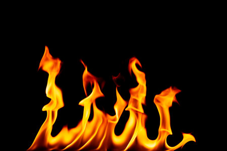 flame fuel png heat and burning hazard explode barbecue red yellow flame isolated on black backgroundの写真素材