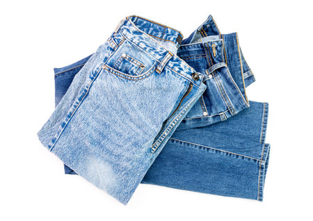blue jeans a pile of denim pants element modern women and men fashion pants texture isolated on white backgroundの写真素材