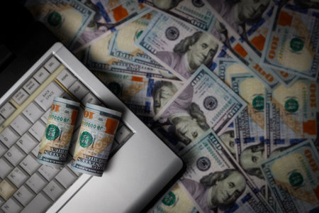 Dollar banknote business idea, banking, finance, investing online with computer. Success isolated on black backgroundの写真素材