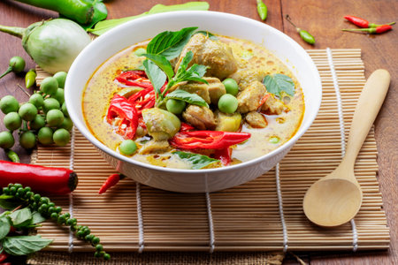 Chicken Green Curry or pork Asian food Thai food on a bowl of soup with a mixture of herbs, vegetables and pepper spices.の写真素材