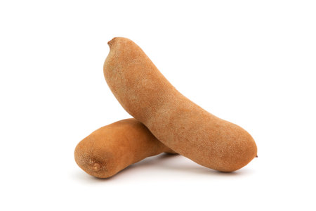 Tamarind has a sweet taste. or sour fruit, healthy natural food, isolated on white backgroundの写真素材