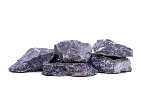 Gray and black granite rock pile from natural mountain close-up isolated on white background.の写真素材
