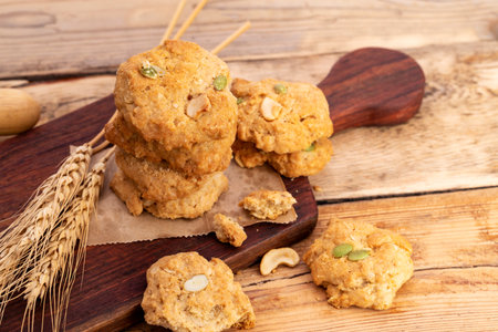 Delicious snack cookies, bakery dessert, arranged on wooden table, top view.の写真素材
