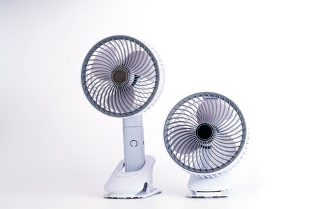 Electric fan powered by usb battery. Product design by modern technology. Isolated on white background.の写真素材