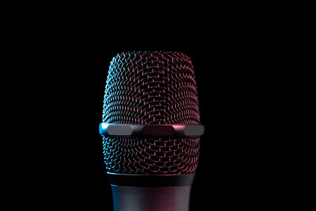 Close-up of microphone in studio or concert performance on stage, on black background.の写真素材