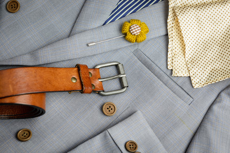 grey plaid texture double breasted suit, brown wood buttons