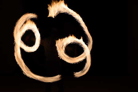 Fire poin in action by a male performance in Thai restaurant