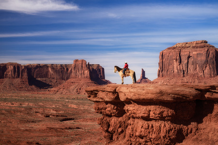 beautiful scene of Native American sitting on a horse in Monument Valley, Utah - Arizona State, America.の写真素材