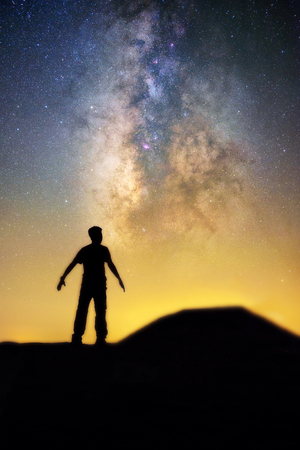 Silhouette man and beautiful close up milky way core. Inspiration and imagination concept. Adventure...