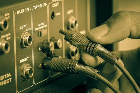 Technician RCA jacks for connecting to the Audio control mixer amplifier is old.の写真素材