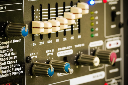 Control of sound levels on a mixer. Amplifier