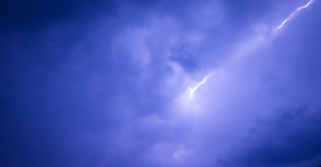 Lightning strike on the dark cloudy sky. In the rainy season in Asia.