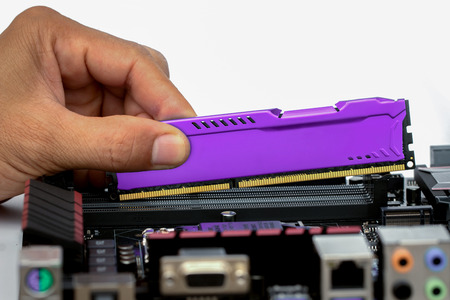 Computer Installing RAM Memory Card 2Gb isolated on white background.の写真素材