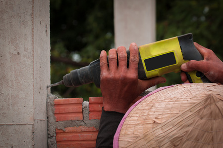 Drill, drill, concrete, Close up construction drill home.の写真素材