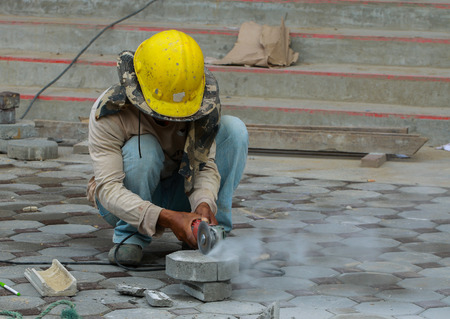 Cut, install, Brick, Bricklaying worm, Builders are laying brick Tile area.