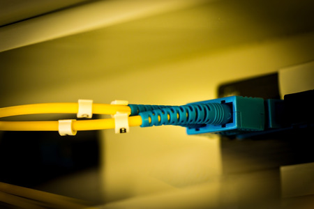 fiber Network Server, shot of network cables and hub in a technology data center.network cables installed in the rack.の写真素材