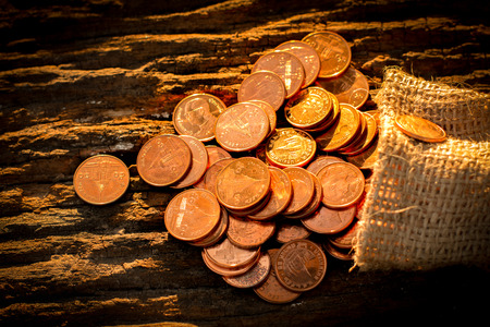 Growing money coins stack with sunset, Saving concept, wealth.の写真素材