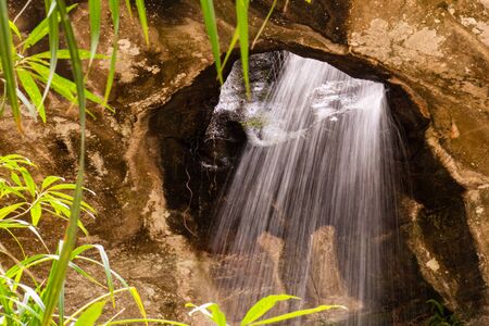 Miracle of Saeng Chan Waterfall (Long Ru Waterfall), Ubon Ratchathani Province, Thailand.The stone...