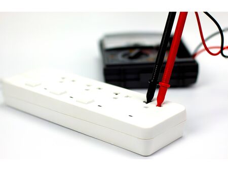 Check the electrical system with a multimeter on a white background.