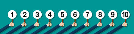 Number score on card in hand of jury. Hand holding card with scorecard. Score number up. Vote of...