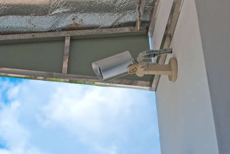 CCTV security camera at home and blue sky