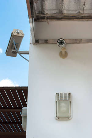 CCTV security camera at home and blue sky