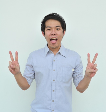 Young man and his tongueの写真素材
