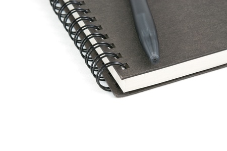Book and pen on white  isolated background