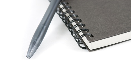 Book and pen on white  isolated backgroundの写真素材