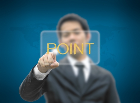 Business man concept hand pointing button point word with world map backgroundの写真素材