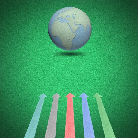 Globes and arrow concept on green background by cork boardの写真素材