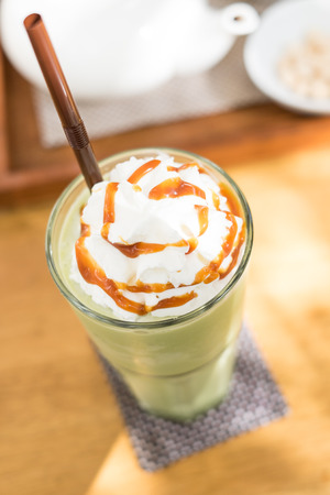 Green tea blended frappuccino on top with whipping creamの写真素材