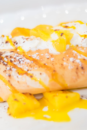 French crepe with mango and whipping creamの写真素材