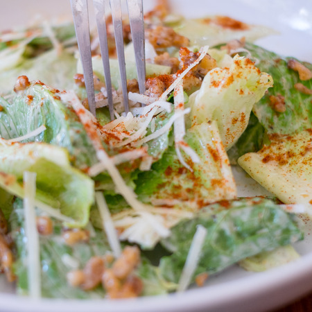 Caesar salad closeup on top of a tableの写真素材