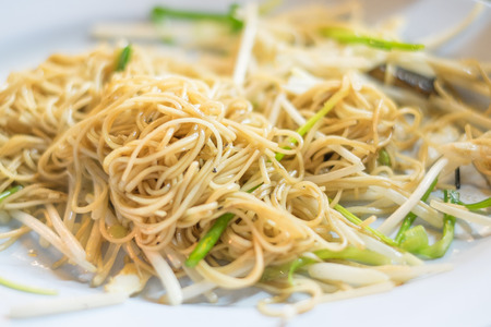 asian fried rice vermicelli with vegetables noodle on a bowlの写真素材