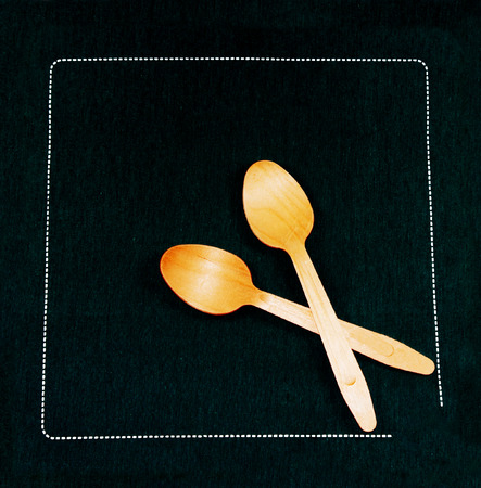 The wood spoons on a black napkinの写真素材