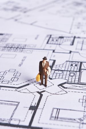 miniature man on plans documentの写真素材